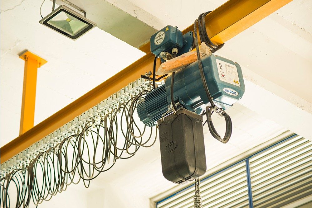 Overhead monorail system with an electric chain hoist installed by SAFCO